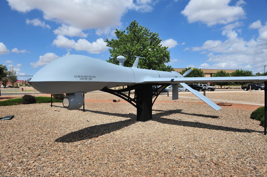 An MQ-1 Predator is on static display in front of Building 1 at Cannon Air Force Base, N.M. The 27th Special Operations Maintenance Squadron pieced the Predator together from scrapped parts of old aircraft.  (U.S. Air Force photo/Tech. Sgt. Josef Cole)