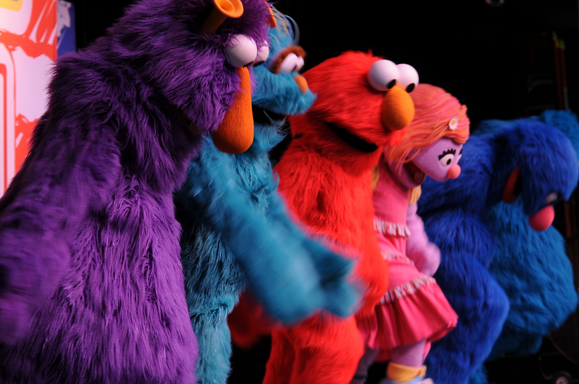 Sesame Street characters perform for members of the KMC during the “Sesame Street USO Experience for Military Families” show, July 24, 2013, Kleber Kaserne, Germany. Members of the show are traveling to U.S. military bases around the world in support of military members and their families. (U.S. Air Force photo/Airman 1st Class Holly Mansfield)