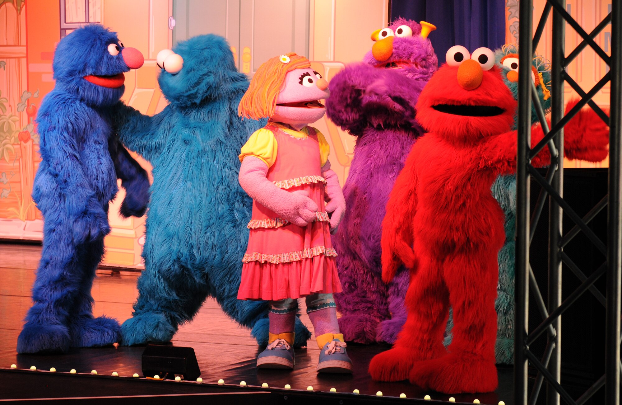 Sesame Street characters perform for members of the KMC during the “Sesame Street USO Experience for Military Families” show, July 24, 2013, Kleber Kaserne, Germany. Members of the show are traveling to U.S. military bases around the world in support of military members and their families. (U.S. Air Force photo/Airman 1st Class Holly Mansfield)