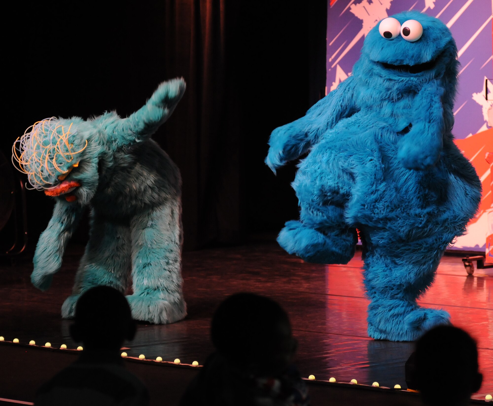 Sesame Street characters perform for members of the KMC during the “Sesame Street USO Experience for Military Families” show, July 24, 2013, Kleber Kaserne, Germany. Members of the show are traveling to U.S. military bases around the world in support of military members and their families. (U.S. Air Force photo/Airman 1st Class Holly Mansfield)