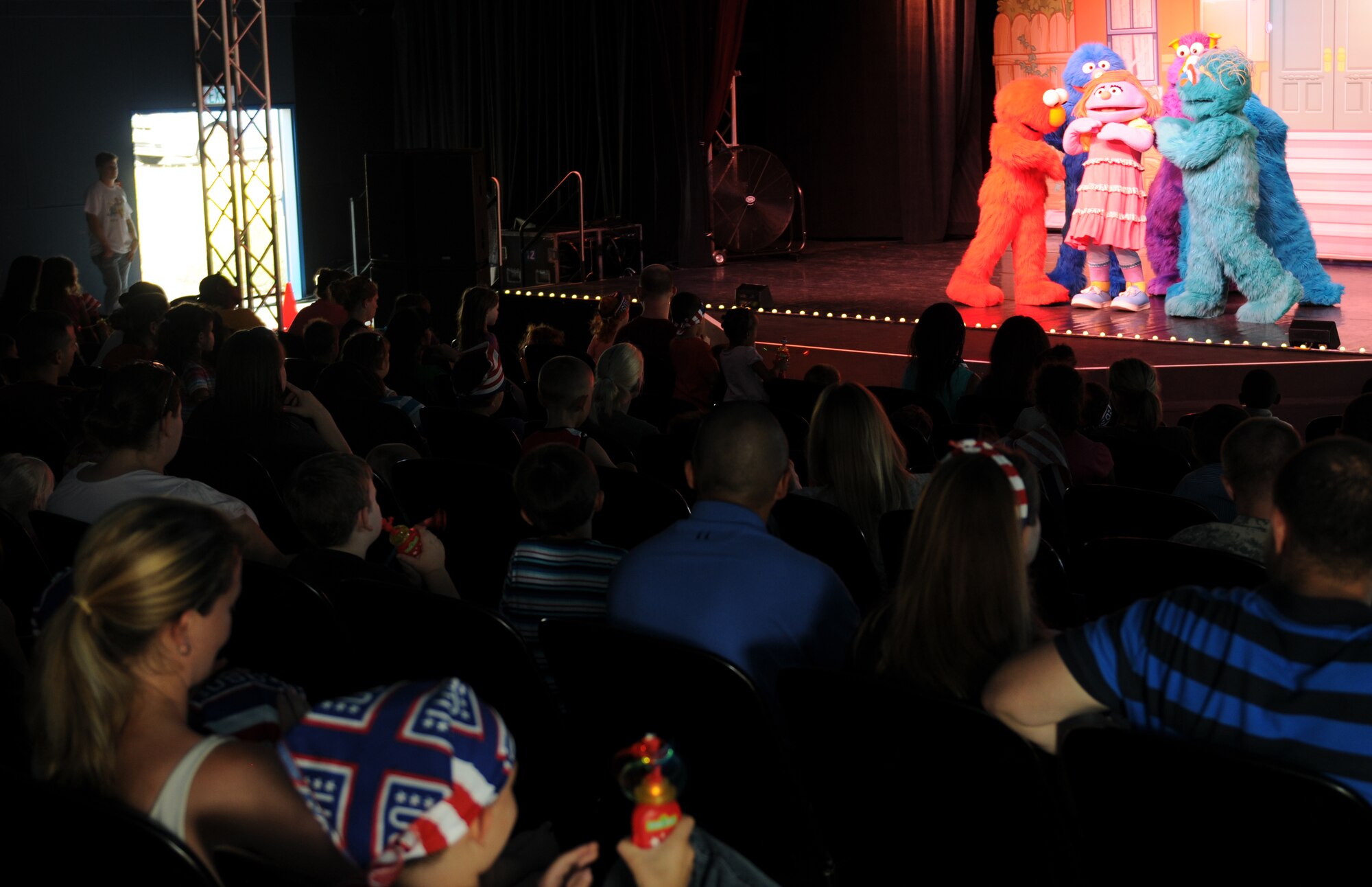 Members of the KMC enjoy “Sesame Street USO Experience for Military Families” show, July 24, 2013, Kleber Kaserne, Germany. Members of the show are traveling to U.S. military bases around the world in support of military members and their families. (U.S. Air Force photo/Airman 1st Class Holly Mansfield)