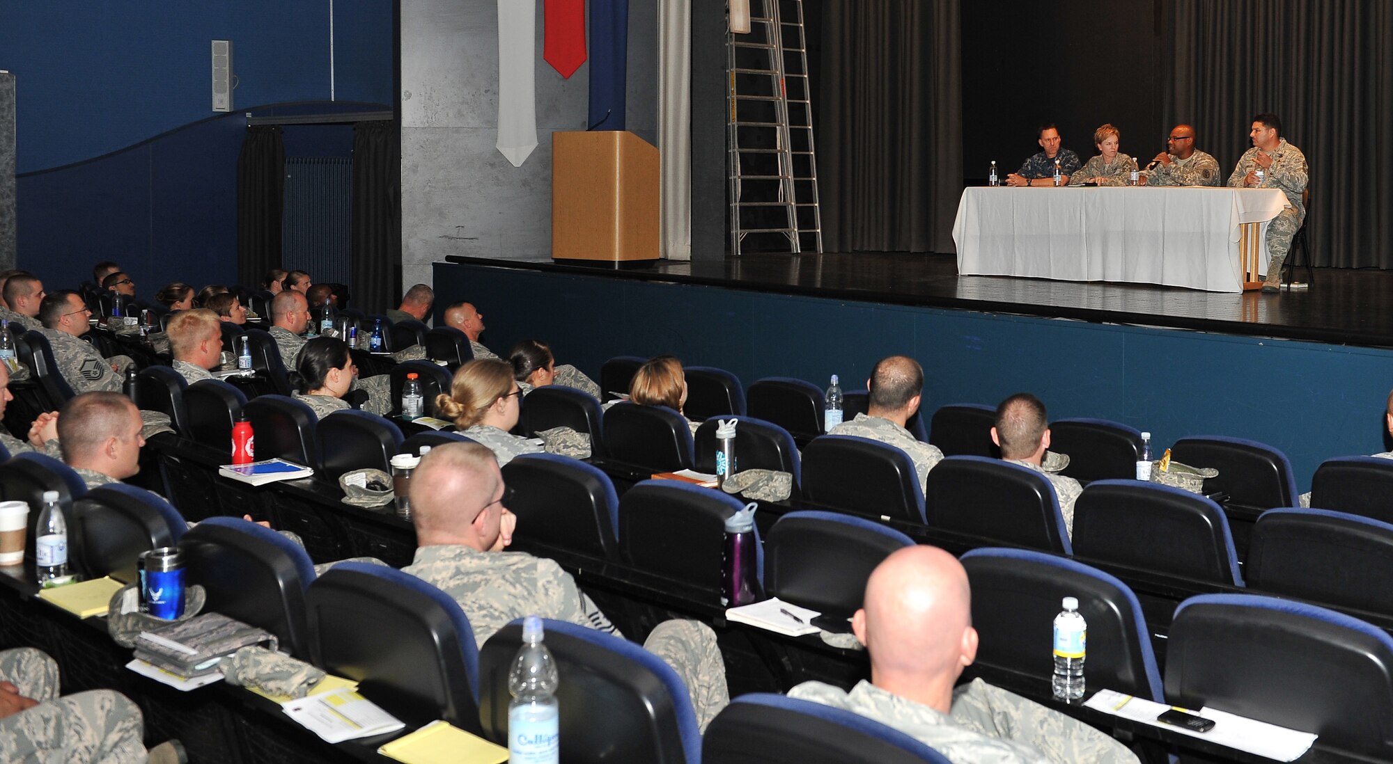 Air Force, Navy and Army NCOs answer questions during the Joint Professional Development Seminar, July 18, 2013, Ramstein Air Base, Germany. The seminar was conducted to encourage service members to continue to stay committed to their respective branches of service. (U.S. Air Force photo/Airman Dymekre Allen)