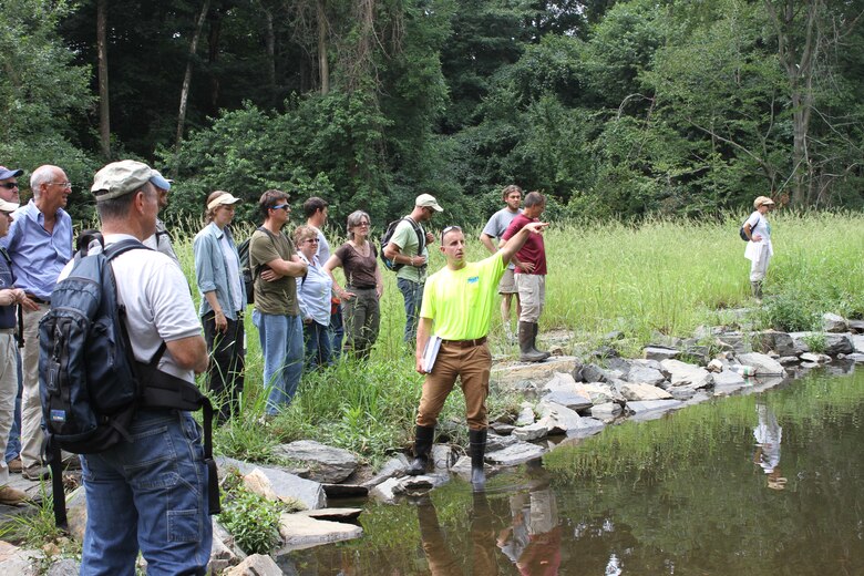 Erik Haniman (middle), manager of the Ecological Restoration Group for the Philadelphia Water Department, discusses the design of the Cobbs Creek (Indian Creek) Habitat Restoration during a stream restoration workshop in Philadelphia July 23. The workshop was hosted by the U.S. Army Corps of Engineers, the Environmental Protection Agency and the Philadelphia Water Department and included participants from federal, state and local agencies.