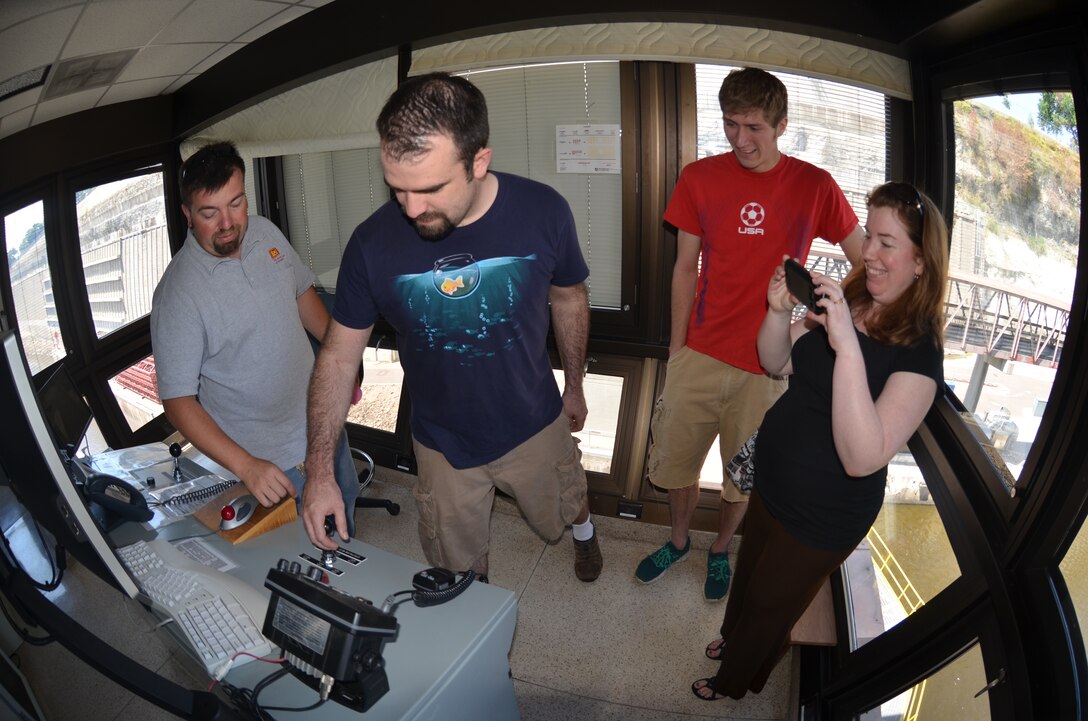 The U.S. Army Corps of Engineers, St. Paul District, hosted an open house at Lock and Dam 1 in Minneapolis on the Mississippi River on July 18, 2013, in celebration of Highland Fest 2013. Tim Tabery (left), Lock and Dam 1 lockmaster, explains how to operate a lock from the control room of the lock house. USACE Photo by Patrick Moes