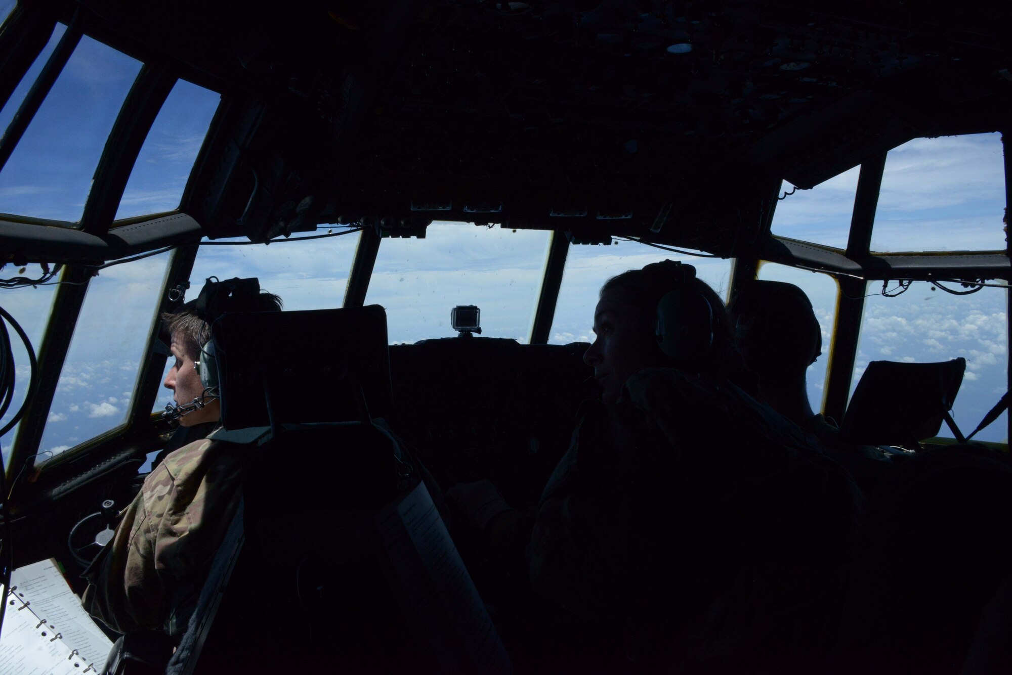 U.S. Air Force Maj. Caroline Beck, 17th Special Operations Squadron MC-130P pilot, identifies a KC-135 Stratotanker's position before an air-to-air refueling begins over the East China Sea July 19, 2013. The squadron regularly conducts air-to-air refueling missions with the 909th Air Refueling Squadron to ensure training proficiency for both units. (U.S. photo by Tech. Sgt. Kristine Dreyer)