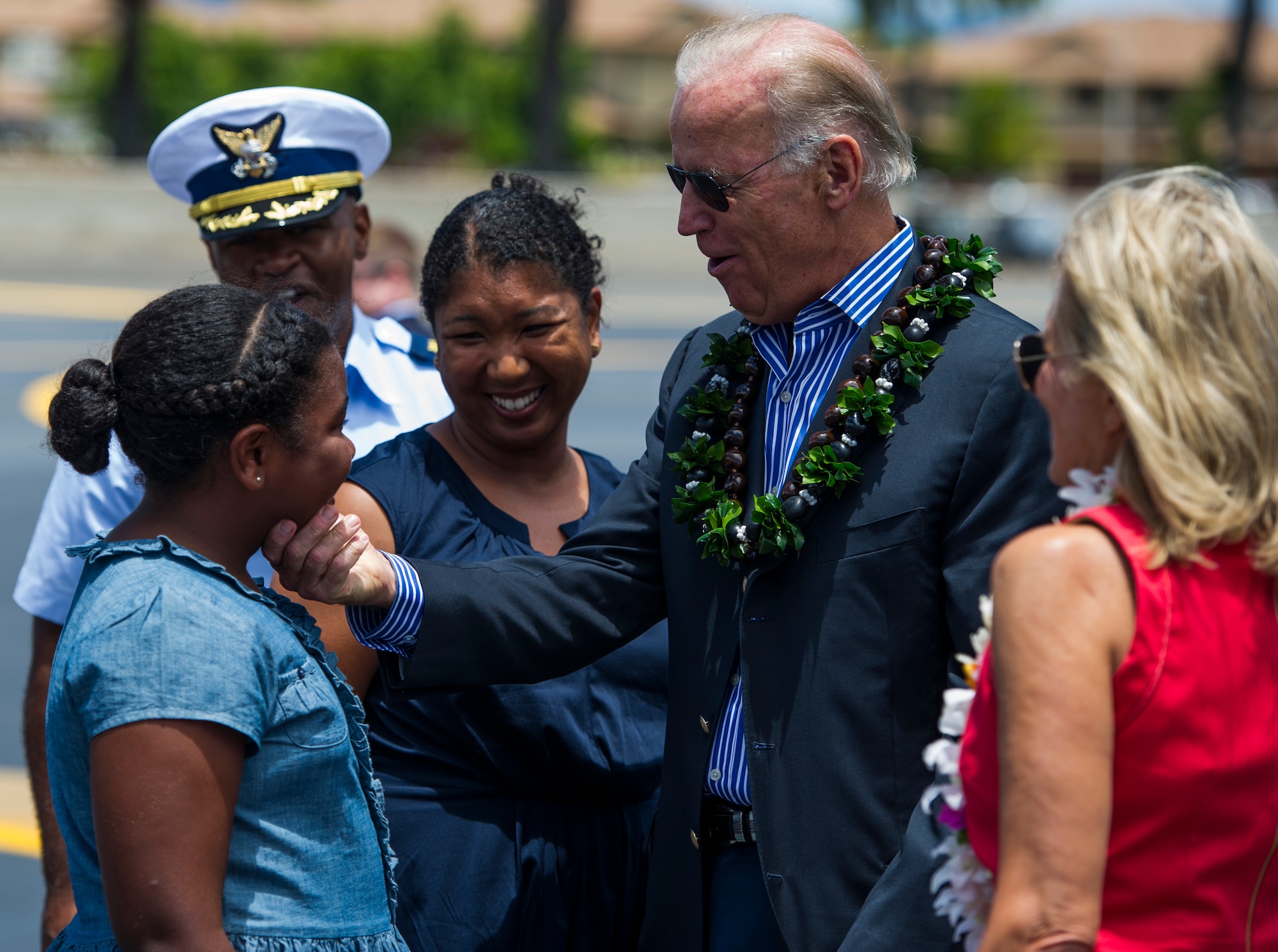 Vice President Joe Biden and his wife, Jill, reunite with Kara Neal, daughter of U.S. Coast Guard Cmdr. Prince Neal, after Biden arrived at Joint Base Pearl Harbor-Hickam, Hawaii, July 27, 2013. Neal is a former military executive aide to Vice President Biden. (U.S. Air Force photo by Staff Sgt. Nathan Allen)