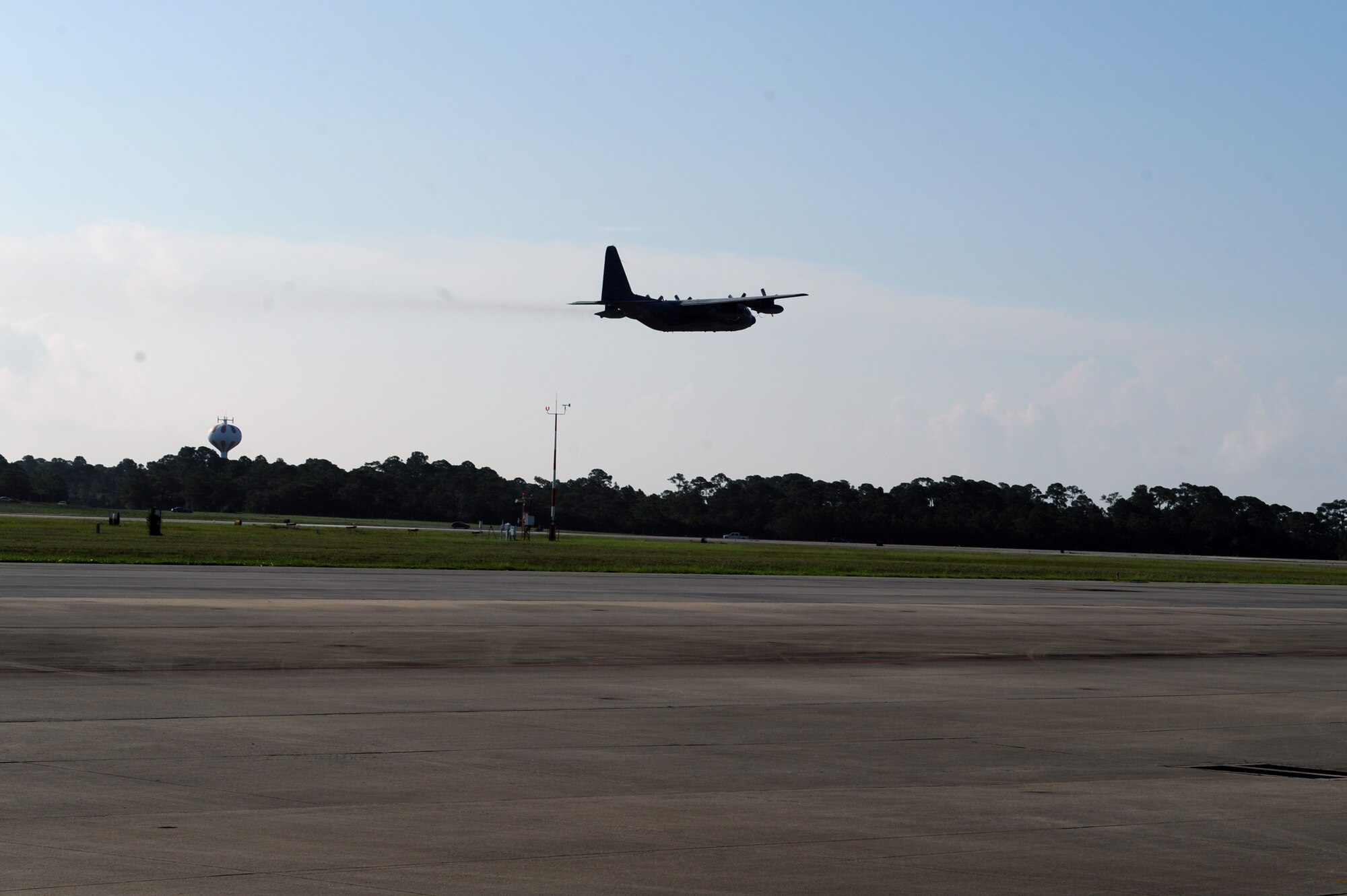 An MC-130P Combat Talon takes off from Hurlburt Field, Fla., July 29, 2013. This aircraft, bearing tail number 5827,flew to the boneyard at Davis-Monthan Air Force Base, Ariz. to be retired. (U.S. Air Force photo/ staff Eboni Reams)