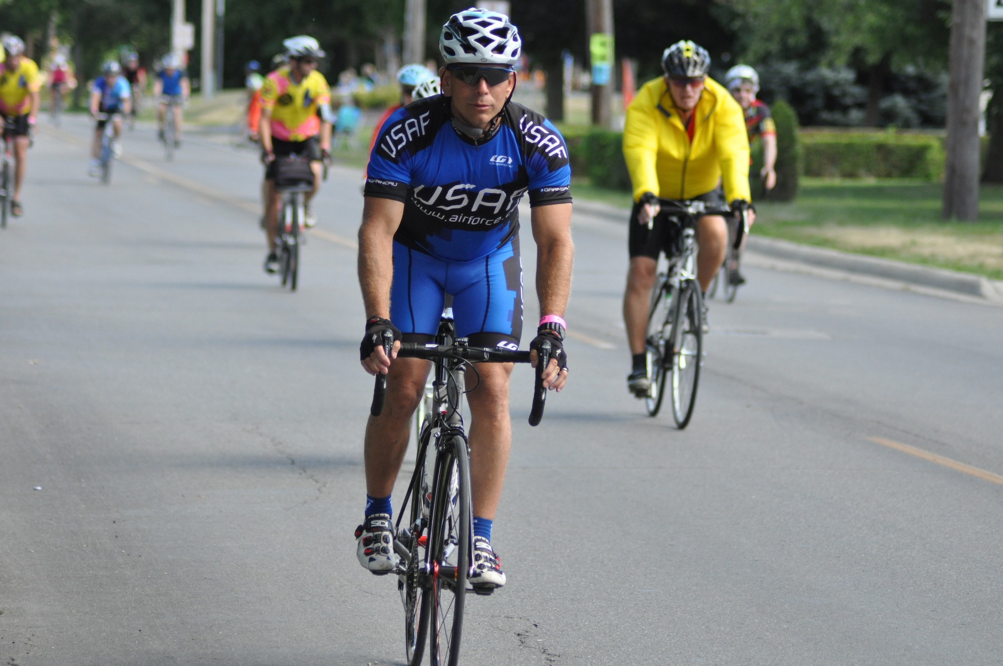 Lt. Col. Mike Rothermel, Air Force Reserve Personnel Center  an assignment facilitator and member of the Air Force Cycling Team, cycles into Fort Madison, Iowa, as part of the Register's Annual Great Bicycle Ride Across Iowa, July 27, 2013.  As with most Air Force teams, the AFCT hosts a variety of Air Force members, many of them Reservists, who are back for the journey, some who are making the journey for the first time.  (U.S. Air Force photo by Staff Sgt. Abigail Klein)

