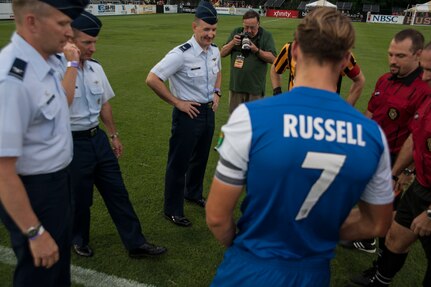 Col. James Fontanella (2nd from left), 315th Airlift Wing commander, along with Col. Darren Hartford (left), 437th Airlift Wing commander, and Col. Michael Mongold (center), 628th Mission Support Group commander conducts the ceremonial coin toss,  July 27, 2013, during Military Appreciation Night at Blackbaud Stadium, Daniel Island, S.C. The Charleston Battery hosted Military Appreciation Night to show their support for the local military community. (U.S. Air Force photo/Senior Airman Ashlee Galloway)