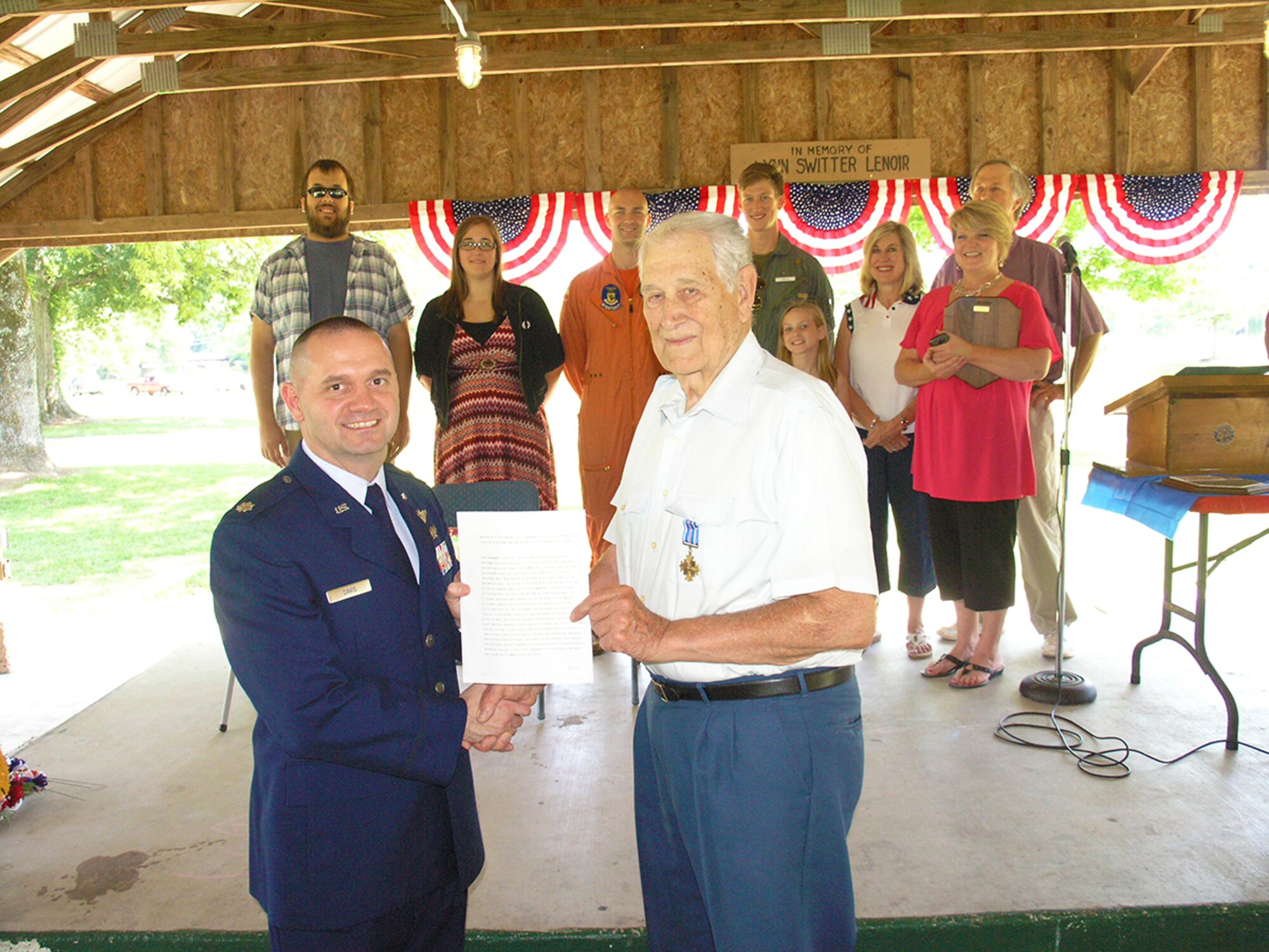 Lt. Col. LeLand Davis (left), the Propulsion Wind Tunnel Test Branch director at the Arnold Engineering Development Complex (AEDC), presents the Distinguished Flying Cross medal to retired Maj. Cecil Smith, a Korean War U.S. Air Force veteran. (photo provided)