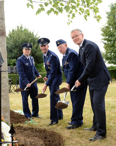 From right, Andrew Harrison, Stansted Airport’s managing director; Retired Maj. Edward Horn, 344th Bomb Group B-26 Marauder pilot; Lt. Col. Timothy Kuehne, 351st Air Refueling Squadron commander; and Col. Travis Willis, U.S. Embassy air attaché; plant a commemorative tree during the 70th anniversary ceremony of Stansted Airport’s runway July 26, 2013, in Stansted Mountfitchet, England. Stansted Airport, known as George Washington Field during World War II, housed the 344th Bomb Group. Horn flew to the U.K. to dedicate a commemorative tree during the ceremony and honor the Airmen of the 344th BG who never returned from their missions.  (U.S. Air Force photo by Airman 1st Class Preston Webb/Released)