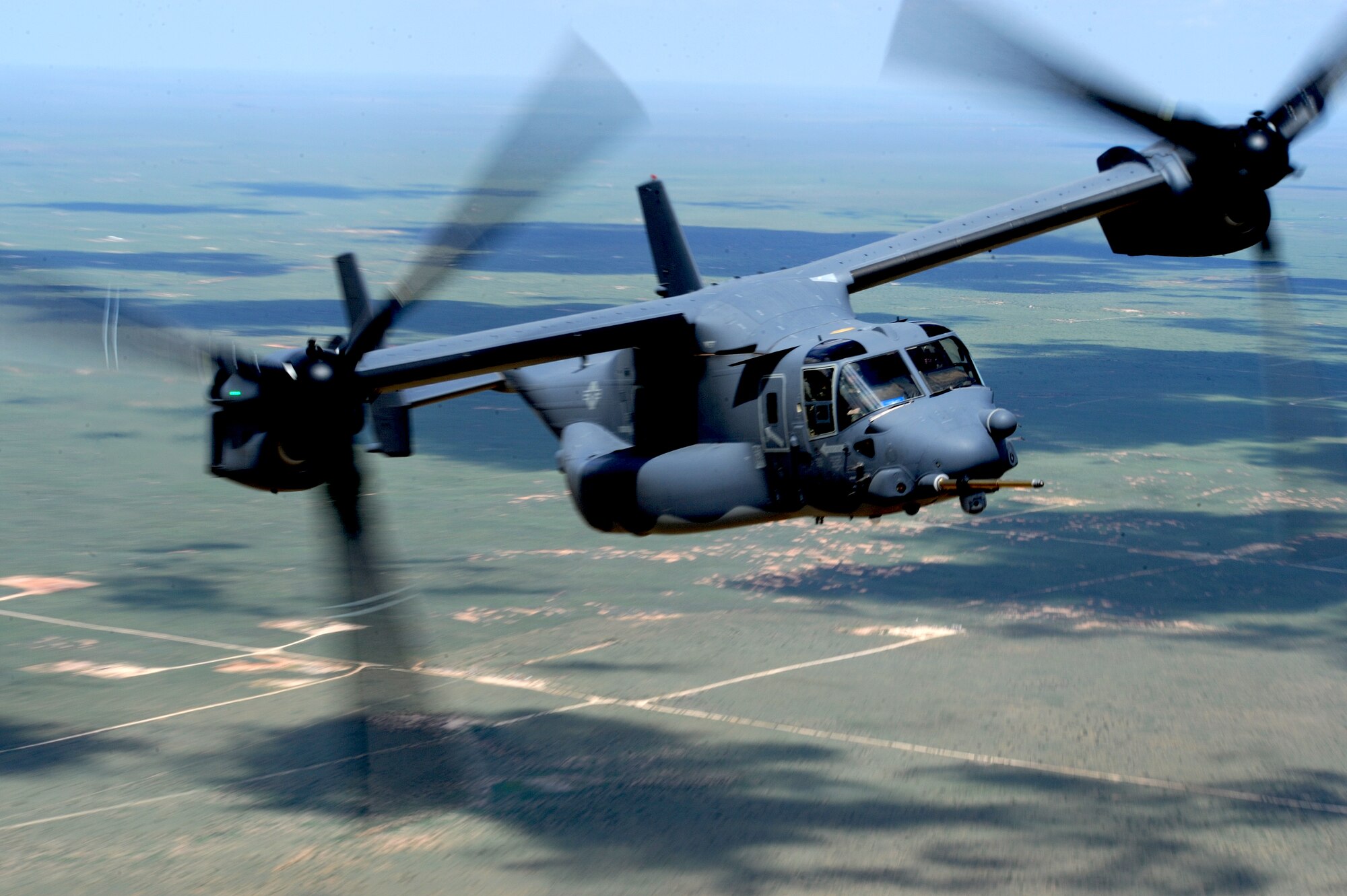A CV-22 Osprey preforms tactical maneuvers July 22, 2013, over Melrose Air Force Range, N.M. The Osprey flew as part of a training mission for the 522nd Special Operations Squadron. (U.S. Air Force photo/Senior Airman Ericka Engblom)