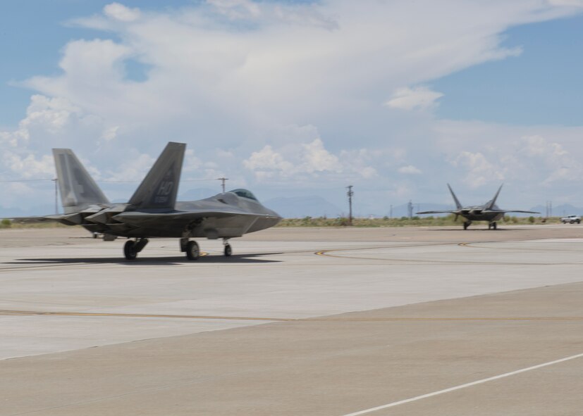 1st Lt. Andrew Van Timmeren, 7th Fighter Squadron F-22 Raptor pilot, taxis on the flightline at Holloman Air Force Base, N.M., July 24. The F-22, a critical component of the Global Strike Task Force, is designed to project air dominance rapidly and at great distances and defeat threats attempting to deny access to our nation’s Air Force, Army, Navy and Marine Corps. (U.S. Air Force photo by Senior Airman Kasey Close/Released)