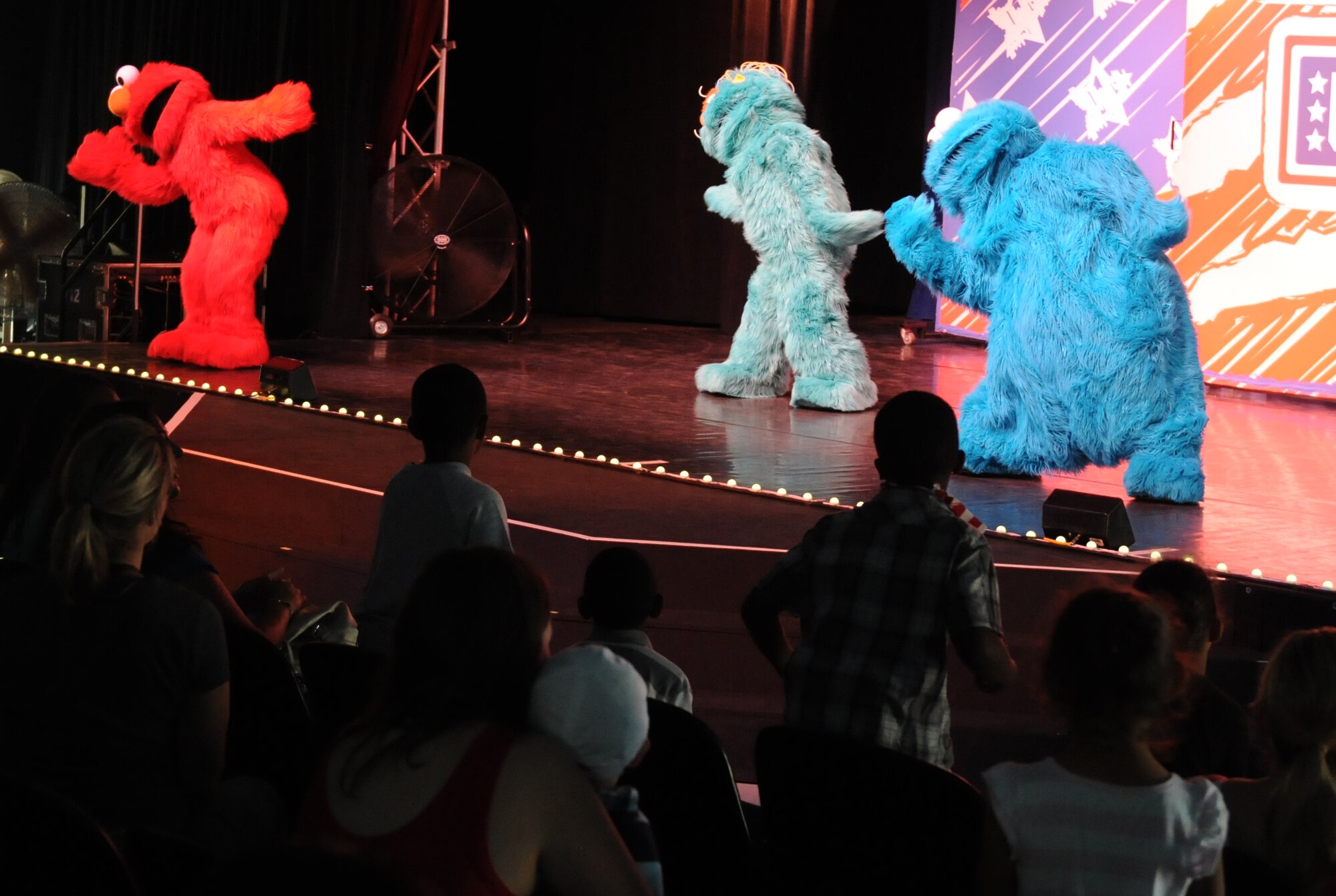 Sesame Street characters perform for members of the KMC during the “Sesame Street USO Experience for Military Families” show, July 24, 2013, Kleber Kaserne, Germany. Members of the show are traveling to U.S. military bases around the world in support of military members and their families. (U.S. Air Force photo/Airman 1st Class Holly Mansfield)