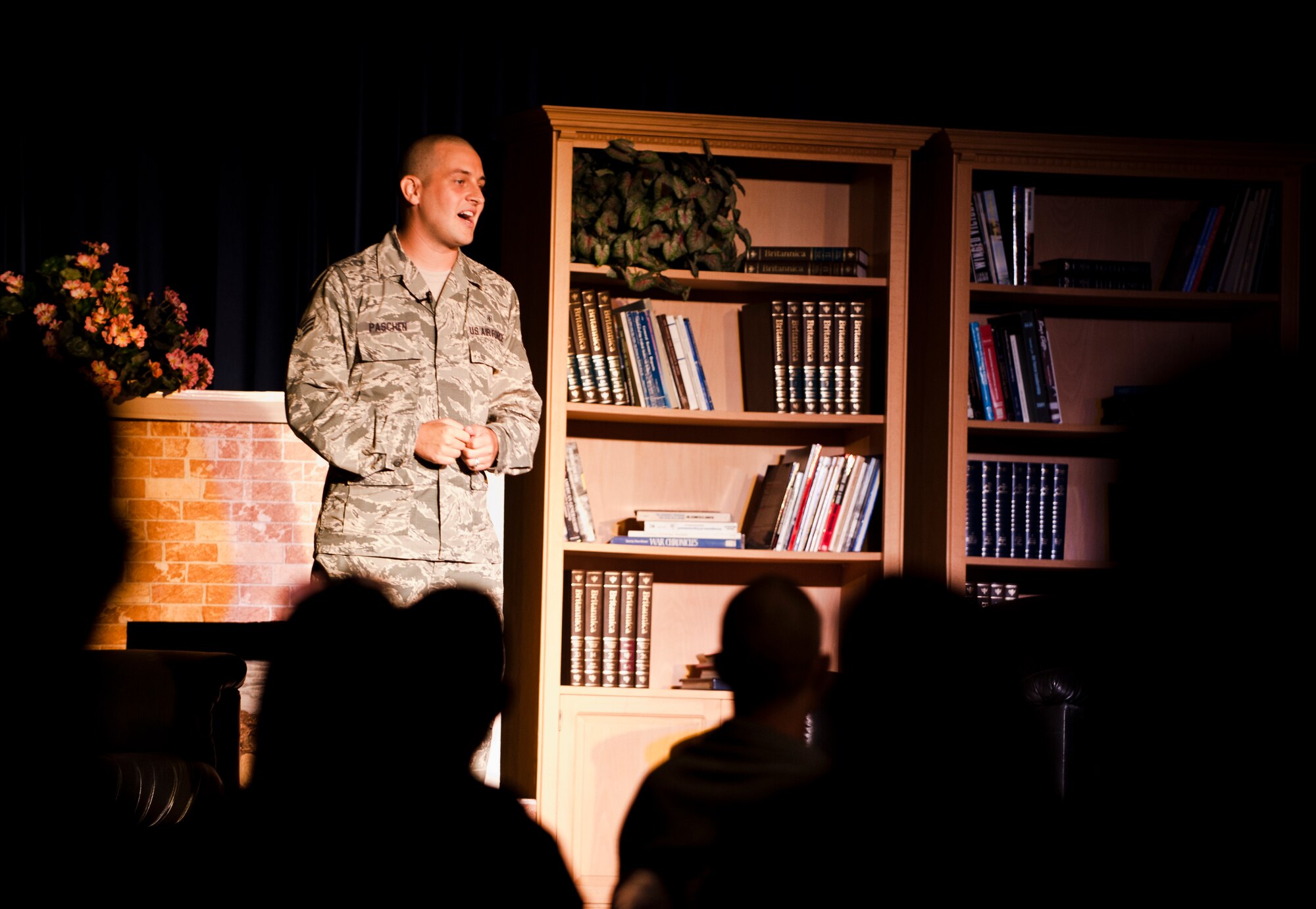 Senior Airman Lee Paschen, 39th Medical Support Squadron radiology technician, shares his childhood experiences during Storytellers III July 27, 2013, at Incirlik Air Base, Turkey.  Paschen was one of four participants in Storytellers III, an event created to provide a forum where Airmen can share experiences and learn about one another, promoting understanding throughout the force. (U.S. Air Force photo by Senior Airman Daniel Phelps/Released)
