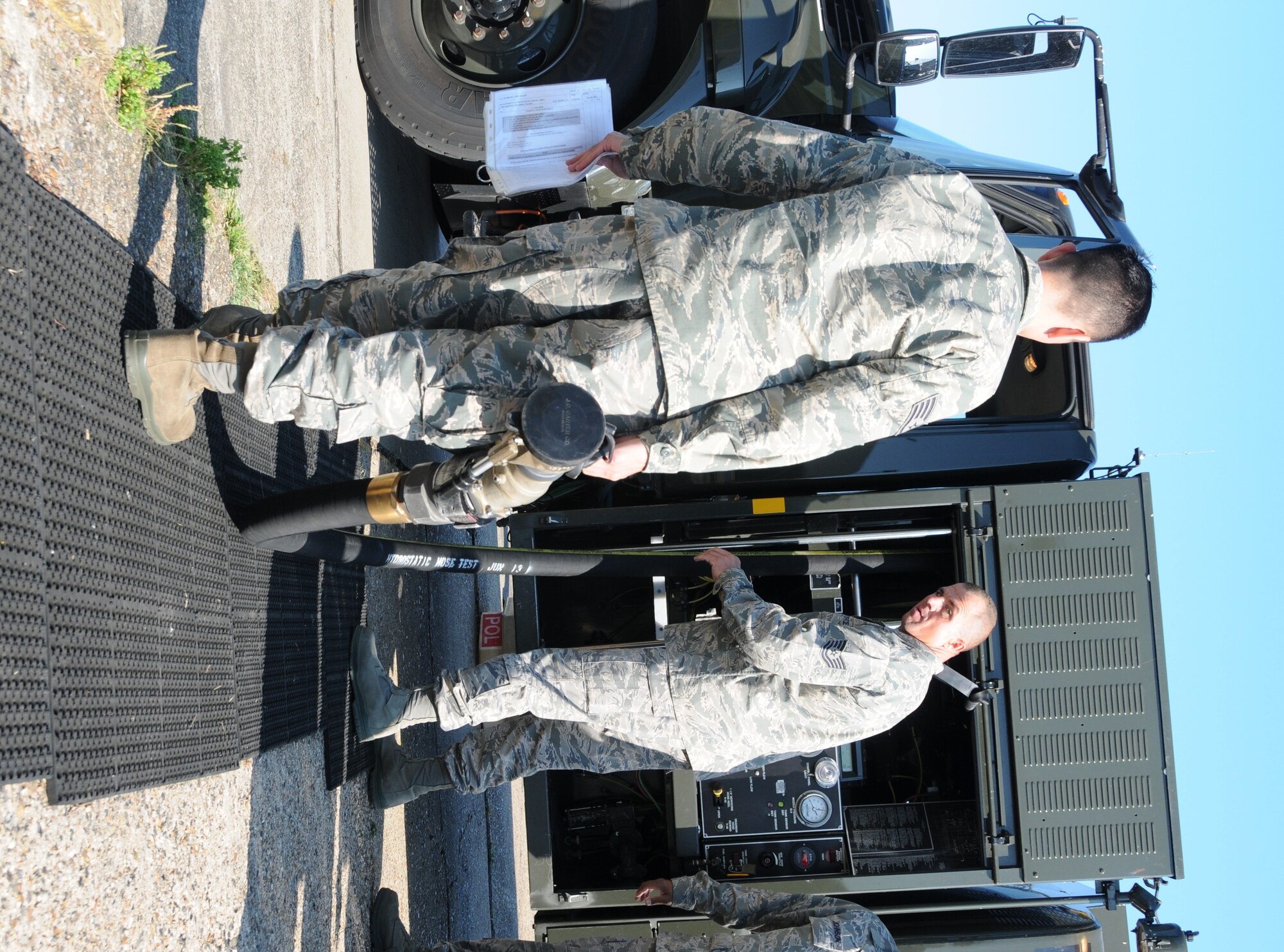 From left, Tech. Sgt. Mike Kuehler and Staff Sgt. Ramsay Tandal, 944th Logistics Readiness Squadron fuels craftsmen from Luke AFB, Ariz. perform a checkpoint inspection on an R-11 refueling truck prior to the truck being used for the day, while on annual tour July 18, 2013, on RAF Mildenhall, England. The 944th LRS worked and trained with the 100th LRS, an active duty unit stationed at RAF Mildenhall, throughout the 944th’s tour. (U.S. Air Force photo by Staff Sgt. Joshua Nason/Released)