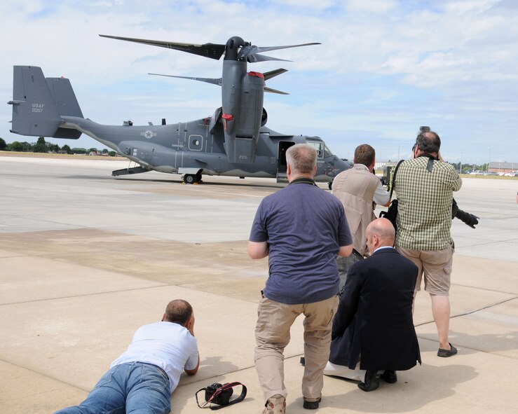 Members of the local media and tail spotters participate in a 352nd Special Operations Group media day July 26, 2013, on RAF Mildenhall, England. Photographers, broadcasters, journalists and tail spotters saw the newly-assigned MC-130J Commando II and CV-22 Osprey aircraft. (U.S. Air Force photo by Gina Randall/Released)