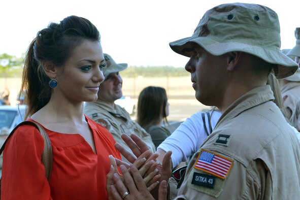 Capt. Joshua Quinn, 10th Airlift Squadron pilot, and his wife, share a moment together in front of the10th AS at Joint Base Lewis-McChord, Wash., July 28, 2013. Quinn and 70 other Airmen departed for a 60-day deployment in support of Operation Enduring Freedom. (U.S. Air Force photo/Airman 1st Class Jacob Jimenez)