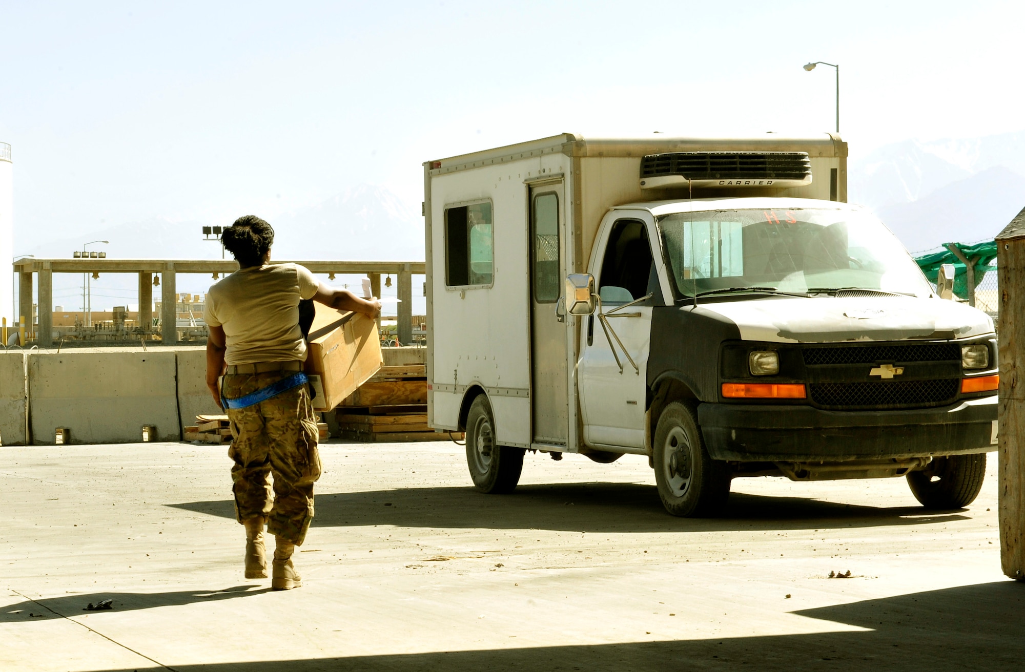 Staff Sgt. Latoya Jenkins, 455 Expeditionary Logistics Readiness Squadron, picks up an aircraft part from the ELRS C-130 aircraft parts store to deliver to maintainers on Bagram Airfield Afghanistan, May 30, 2013. Jenkins is ELRS supply liaison for the C-130 Expeditionary Aircraft Maintenance Unit here. As a liaison, she orders picks up and turns due in for maintenance parts in. She is deployed from Little Rock Air Force Base, Ark., and a native of Rayville, La. (U.S. Air Force photo/ Staff Sgt. Stephenie Wade)