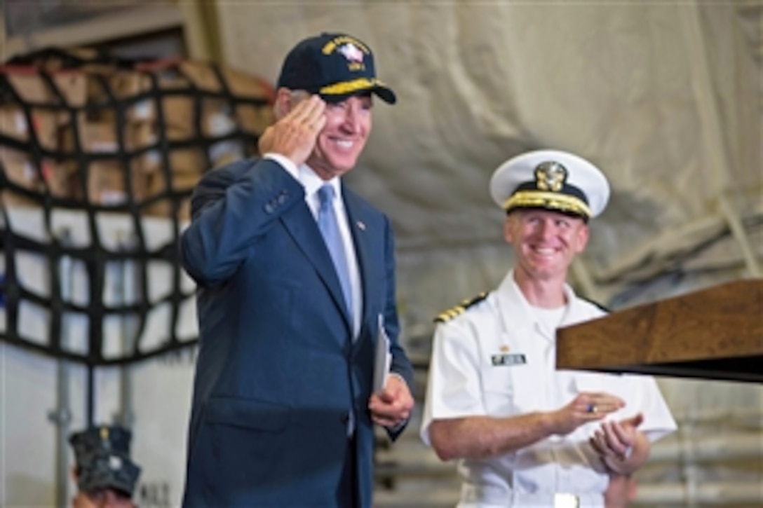 U.S. Vice President Joe Biden salutes the crew of the USS Freedom during a visit to the ship to thank U.S. sailors and their families for their service in Singapore, July 27, 2013. 