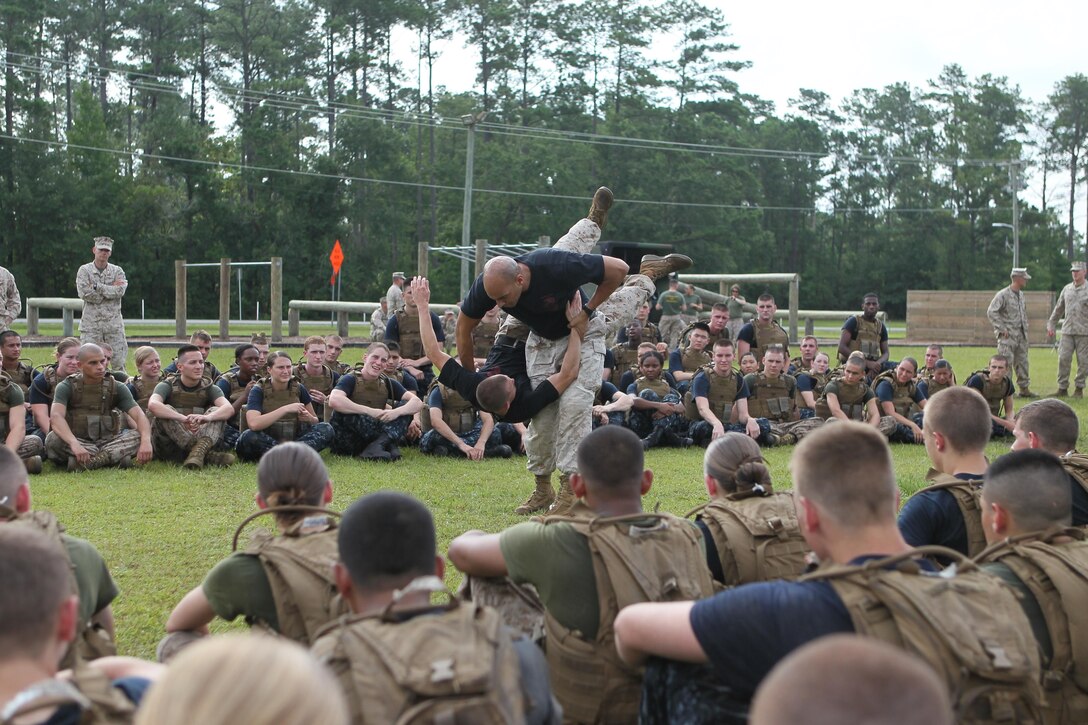 Midshipmen from the contramid program, get an overall MCMAP demonstration from Marine Corps Base Camp Geiger July 20.