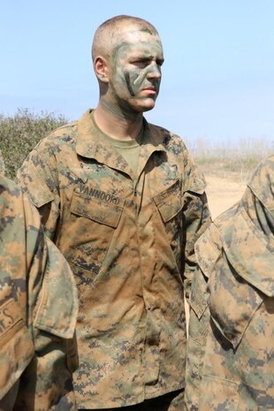 Pvt. Justin B. Vannoord Platoon 1033, Company B, 1st Recruit Training Battalion, stands at attention while a citation is read during the Crucible at Edson Range aboard Marine Corps Base Camp Pendleton, July23. Citations are found in all 30 Crucible events and recognize heroic actions Marines have done in the past. Each Crucible event emulates the actions read in the citation and drill instructors tie in the lesson and meaning behind it.