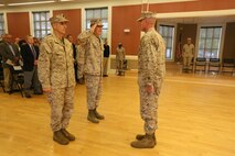Navy Capt. Francisco R. Leal (center), the outgoing commanding officer of 2nd Dental Battalion, Naval Dental Center, 2nd Marine Logistics Group, salutes Brig. Gen. Edward D. Banta (right), the commanding general of 2nd Marine Logistics Group, during a change of command ceremony aboard Camp Lejeune, N.C., July 29, 2013. Capt. Rodney L. Gunning (left) assumed command of 2nd Dental Battalion after the traditional ceremony marked the official passing of responsibility and accountability of the battalion between the two officers.