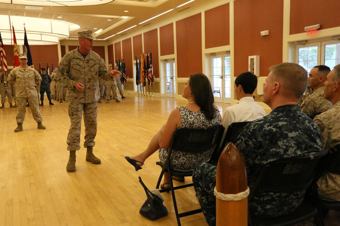 Brig. Gen. Edward D. Banta, the commanding general of 2nd Marine Logistics Group, discusses the career of Navy Capt. Francisco R. Leal, the outgoing commanding officer of 2nd Dental Battalion, Naval Dental Center, 2nd Marine Logistics Group, during a change of command ceremony aboard Camp Lejeune, N.C., July 29, 2013. Leal will move on to an assignment in Washington, D.C.
