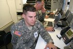 Chief Warrant Officer Larry Fuller and Chief Warrant Officer Kenneth Drennon, both members of Joint Forces Headquarters-South Carolina, work to maintain the communications network during Vigilant Guard 2008, April 20, 2008. Vigilant Guard is one of the largest disaster response training exercises in the history of the National Guard, involving more than 3,000 Soldiers and Airmen from more than a dozen states.