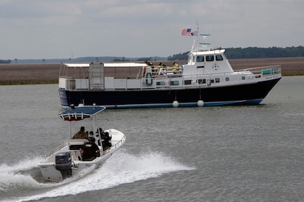 More than a dozen law enforcement and local-area first responders joined the South Carolina National Guard in a highly realistic maritime anti-terrorism exercise in Port Royal Sound today as part of Vigilant Guard; the largest natural disaster preparedness exercise ever conducted by the South Carolina National Guard.; The exercise scenario consisted of a terrorist organization hijacking a local ferry boat as a platform for deploying a "dirty bomb" in the Port Royal harbor. National Guard helicopters; the Beaufort Police Department and the Beaufort County Sheriff's Department observed the "hijacked" vessel and requested local-area and Guard HAZMAT and Civil Service Team (CST) assistance. Vigilant Guard tested about 100 local-area law enforcement and first responders with responding to a potential maritime terrorist threat. Beaufort County Sherrif's Department SWAT team members approach the 'hijacked' ship.