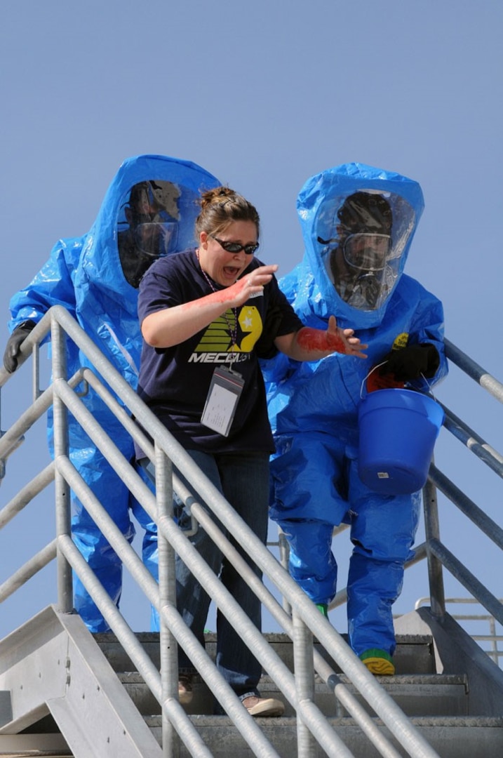 Mock casualty Blakely McClellan recieves assistance from the Nevada Army National Guard's 92nd Civil Support Team team during the Vigilant Guard exercise in Reno on June 14. The exercise scenario that day included a hazardous material spill that endangered civilians.