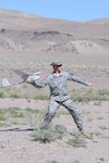 Sgt. Eric Hintermeyer of the Nevada National Guard's Counterdrug Task Force launches a Raven unmanned aerial vehicle during the 2008 Vigilant Guard exercise on June 13 in Fallon, Nev. During the exercise, the small aircraft displayed to emergency responders its ability to assist incident commanders with reconnaissance and intelligence capabilities during domestic contingencies.