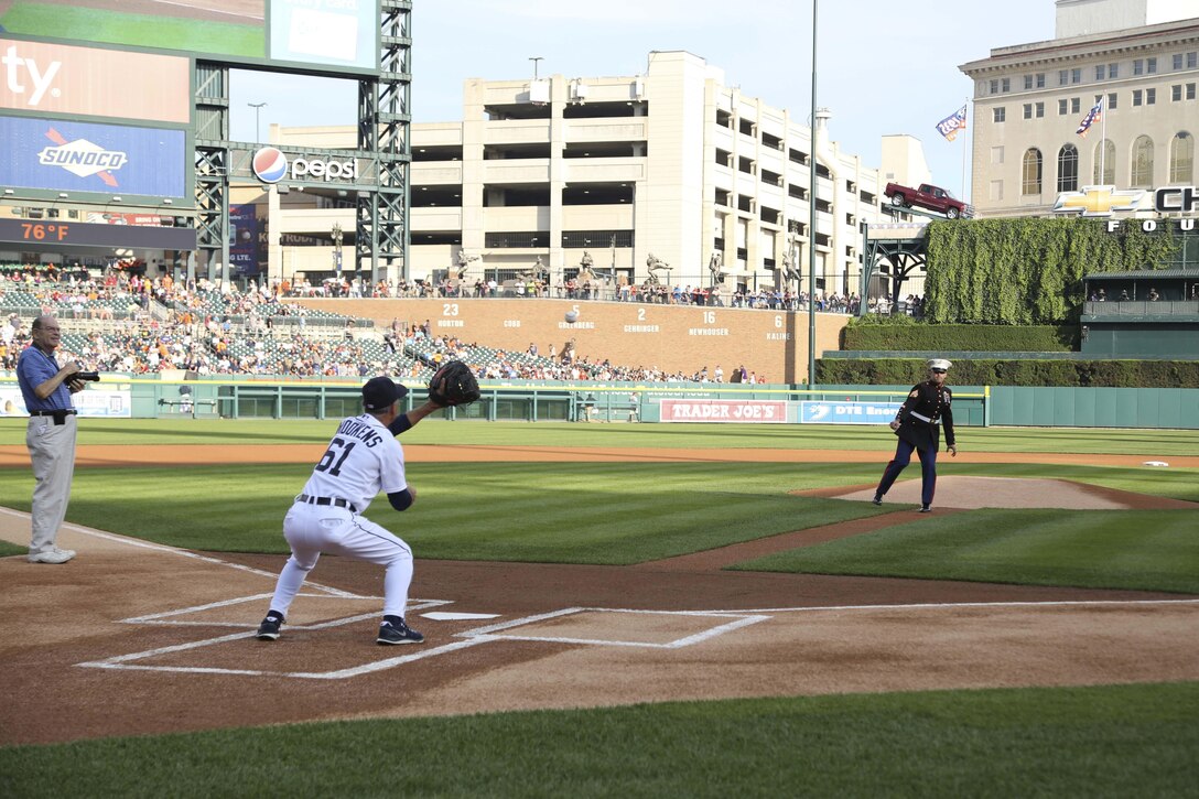 U.S. Marine Corps Staff Sgt. Dominic Freda throws the first pitch at a Detroit Tigers game July 26, 2013. Freda, 31, a Livonia, Mich., native, is a Marine Corps recruiter with Recruiting Sub-Station Ypsilanti in Ypsilanti, Mich.