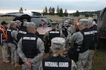 Members of the Washington National Guard 10th Weapons of Mass Destruction-Civil Support Team prepare to enter Leschi Town early May 2 at Fort Lewis, Wash., during National Level Exercise 2008. The Department of Homeland Security exercise was designed to test local, state, federal and military responders to perform roles and responsibilities related to homeland defense in the event of a catastrophic emergency. This exercise was in response to a simulated terrorist attack using a chemical agent.