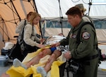 Members of the CERF-P triage team treat a roleplayer for simulated wounds during the training scenario and evaluation at Camp Blanding Joint Training Center, Feb. 28. 2009.