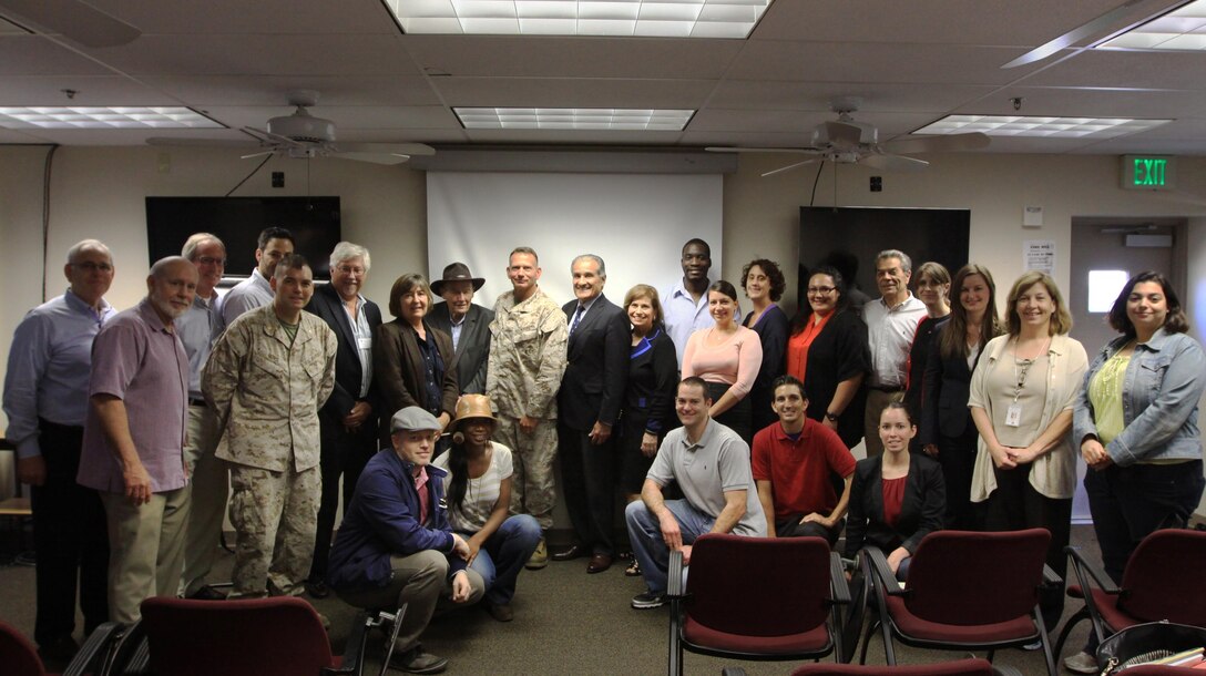 Civilian attorneys from surrounding counties and Marines from Legal Service Support Section pose for a photo during the Help for Heroes event here, July 27. The Marines and attorneys volunteered their time to give legal service and advice to service members and their families on common problems they may have.