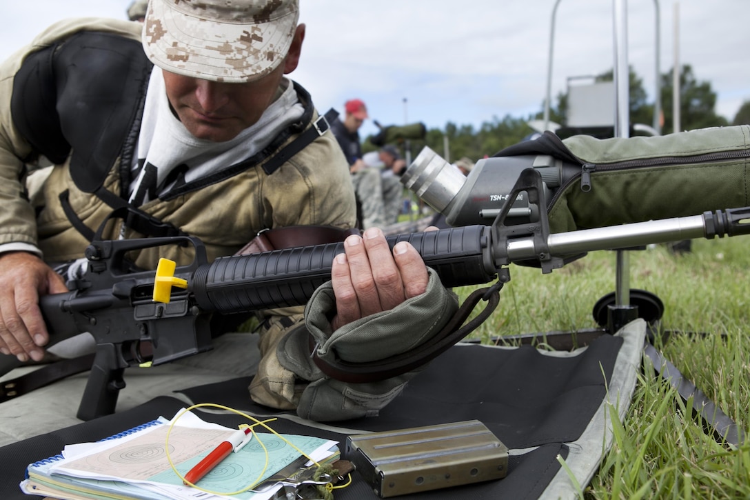 Sgt. Jesse Bragg, a member of the Marine Forces Reserve Marksmanship Training Unit, Marine Corps Reserve Rifle Team, based out of Marine Corps Base Quantico, Va., prepares to put rounds on target from the 300-yard line during the President's 100 Rifle Match at Camp Perry, Ohio July 29, 2013. The rifle match is part of the annual Civilian Marksmanship Program's National Matches, which have been taking place annually since 1903. (U.S. Marine Corps Photo by Cpl. Jessica Ito)
