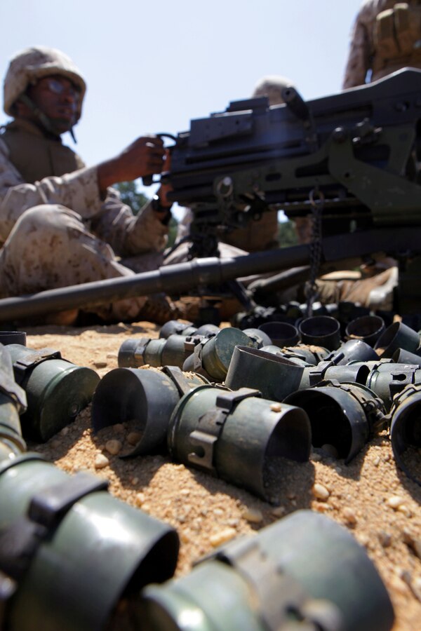 Lance Cpl. John Bailey II, a bulk fuel specialist with Bulk Fuel Company B, 6th Engineer Support Battalion, and native of Largo, Md., loads a MK19 40mm grenade launcher during a crew-served weapons range here, July 16. Bulk fuel Marines practiced setting up fueling positions and protecting those positions from notional enemy combatants. Marines responsible for guarding the fuel conducted a series of live fire ranges to become more proficient with their service rifles and crew-served weapons. 
