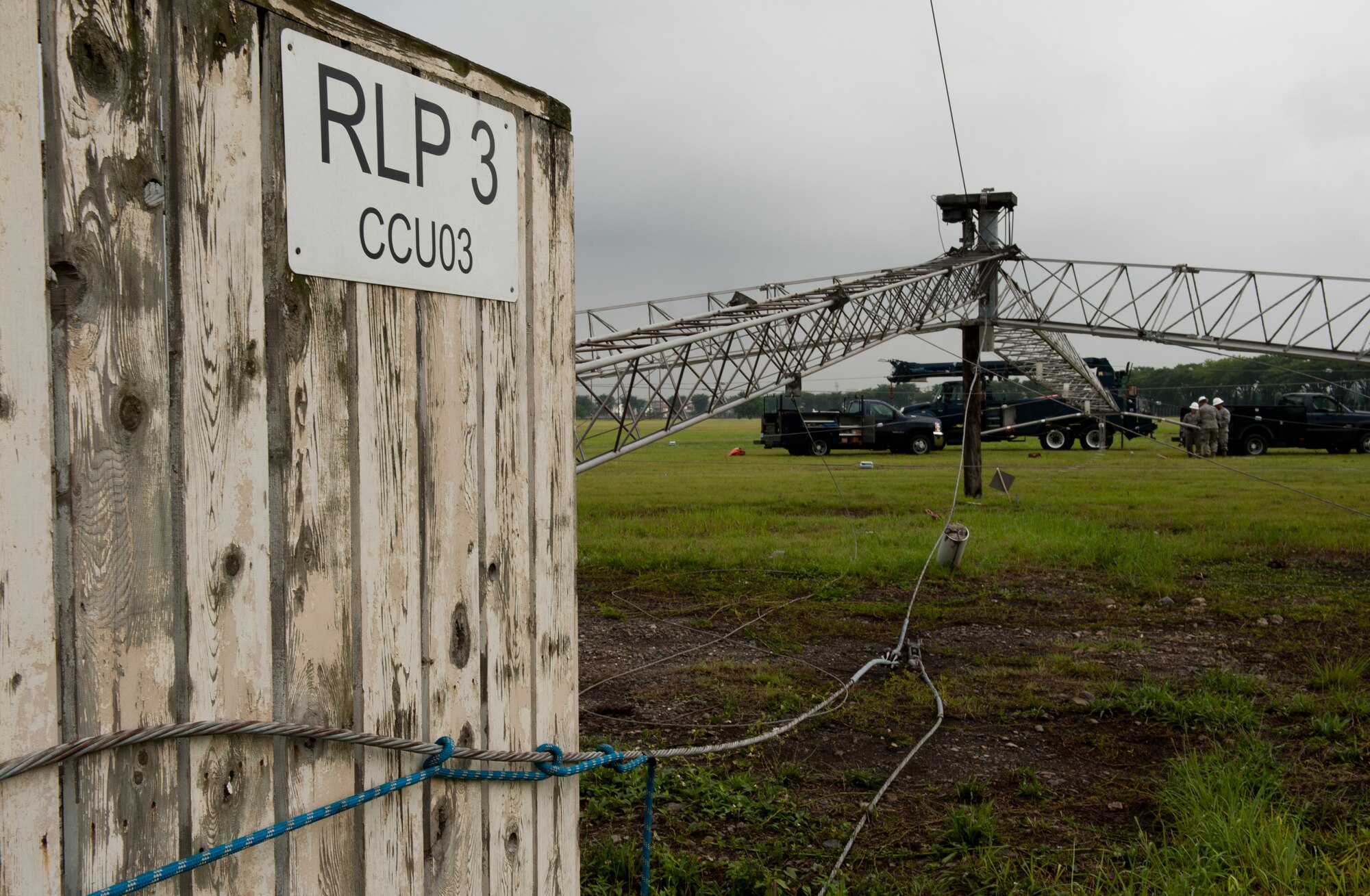 A team assigned to the 374th Communications Squadron cable and antenna maintenance shop conduct scheduled maintenance on a rotatable log periodic antenna July 26, 2013, at the Tokorozawa Communication Site, Japan. The maintenance consisted of replacing the antenna’s crystalline plastic to newer, stronger plastic, taking the safety life from five to 10 years. (U.S. Air Force photo by Senior Airman Cody H. Ramirez)