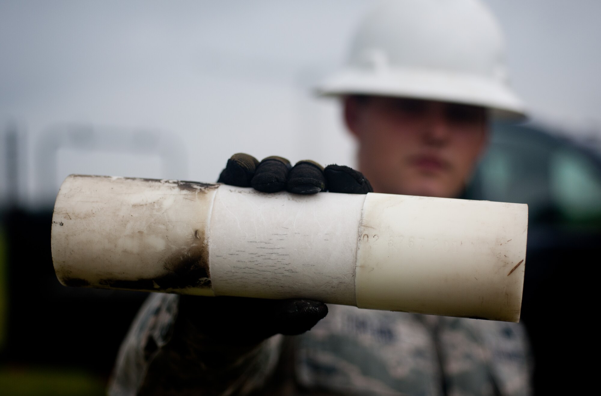 Airman 1st Class Mike Turland, 374th Communications Squadron cable and antenna maintenance technician, removes crystalline plastic used as bridges between antenna segments from a rotatable log periodic antenna July 26, 2013, at the Tokorozawa Communication Site, Japan. The plastic shows wear from years of tension. (U.S. Air Force photo by Senior Airman Cody H. Ramirez)