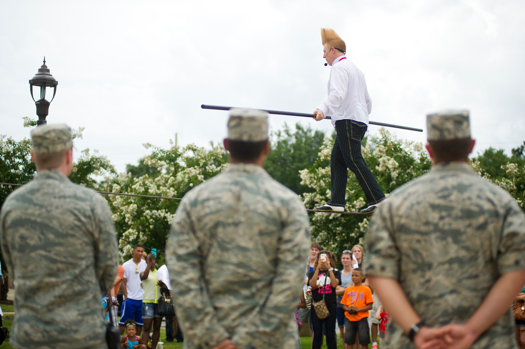 Bello Nock advances along a high wire during a military appreciation performance of Funambula, July 27, 2013, at Welch Theater, Keesler Air Force Base, Miss. Funambula is a theatrical circus act including many acrobatic acts as well as contortionists. (U.S. Air Force photo by Adam Bond))