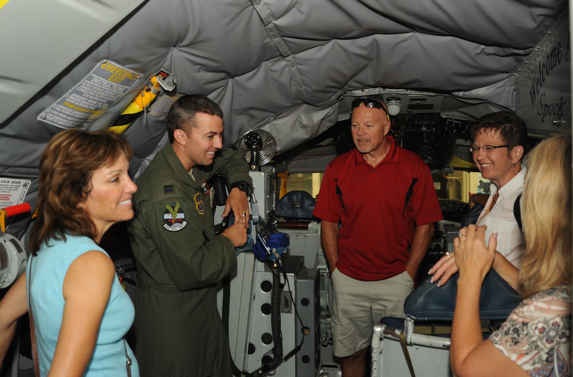 Capt. Remington Barnes, 92nd Air Refueling Squadron KC-135 Stratotanker pilot, shows visitors from the Post Falls, Idaho, Chamber of Commerce the cockpit of a KC-135 at Fairchild Air Force Base, Wash., July 26, 2013.  The Post Falls Chamber of Commerce visited the base to enhance its interaction with the Inland Northwest community.  (U.S. Air Force photo by Airman 1st Class Sam Fogleman/Released) 