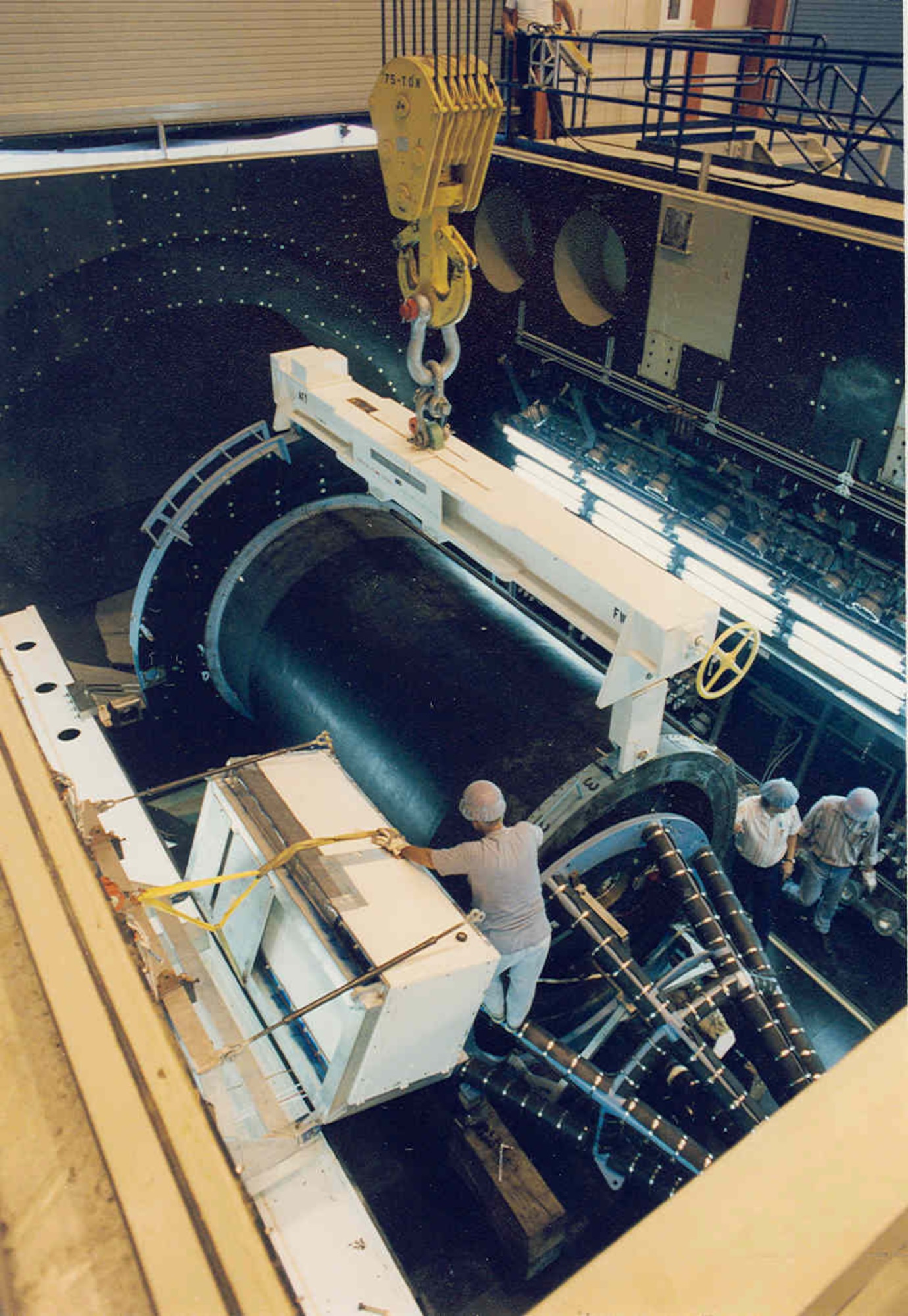 The Peacekeeper Stage II ICBM rocket motor is prepared for the first validation motor firing in the J-6 rocket test cell in 1994. (AEDC photo)