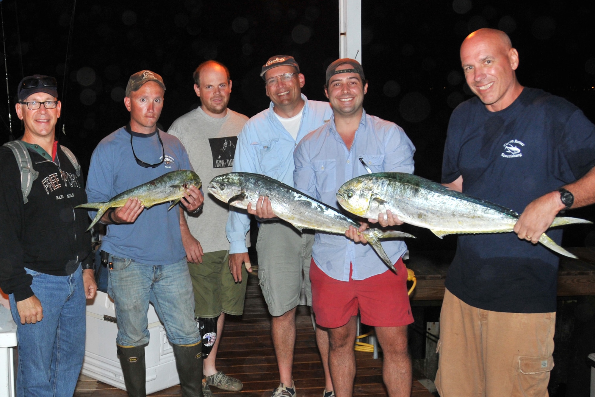 Retired Active Duty and current New Jersey Army and Air National Guard members display their catch of mahi mahi after an all day fishing trip to the Hudson Canyon, Atlantic Ocean, aboard the charter boat Canyon Runner on July 3, 2013. (U.S. Air National Guard Photo by Master Sgt. Andrew J. Moseley/Released)