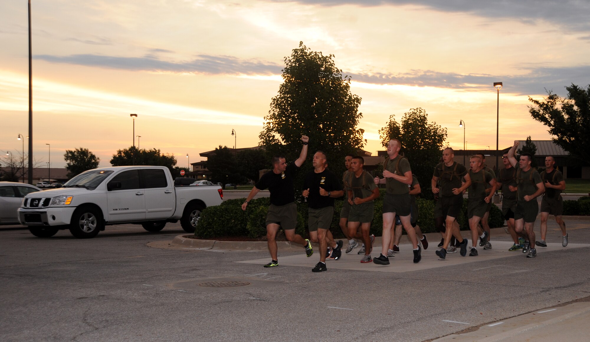 The members of U.S. Marine Corps Corporals Course Class 350-13 finish their final physical training session of the course in a group run July 25, 2013, at McConnell Air Force Base, Kan. The Corporals Course is designed to improve and provide the education and leadership skills necessary for new non-commissioned officers. (U.S. Air Force photo/Airman 1st Class Jose L. Leon)