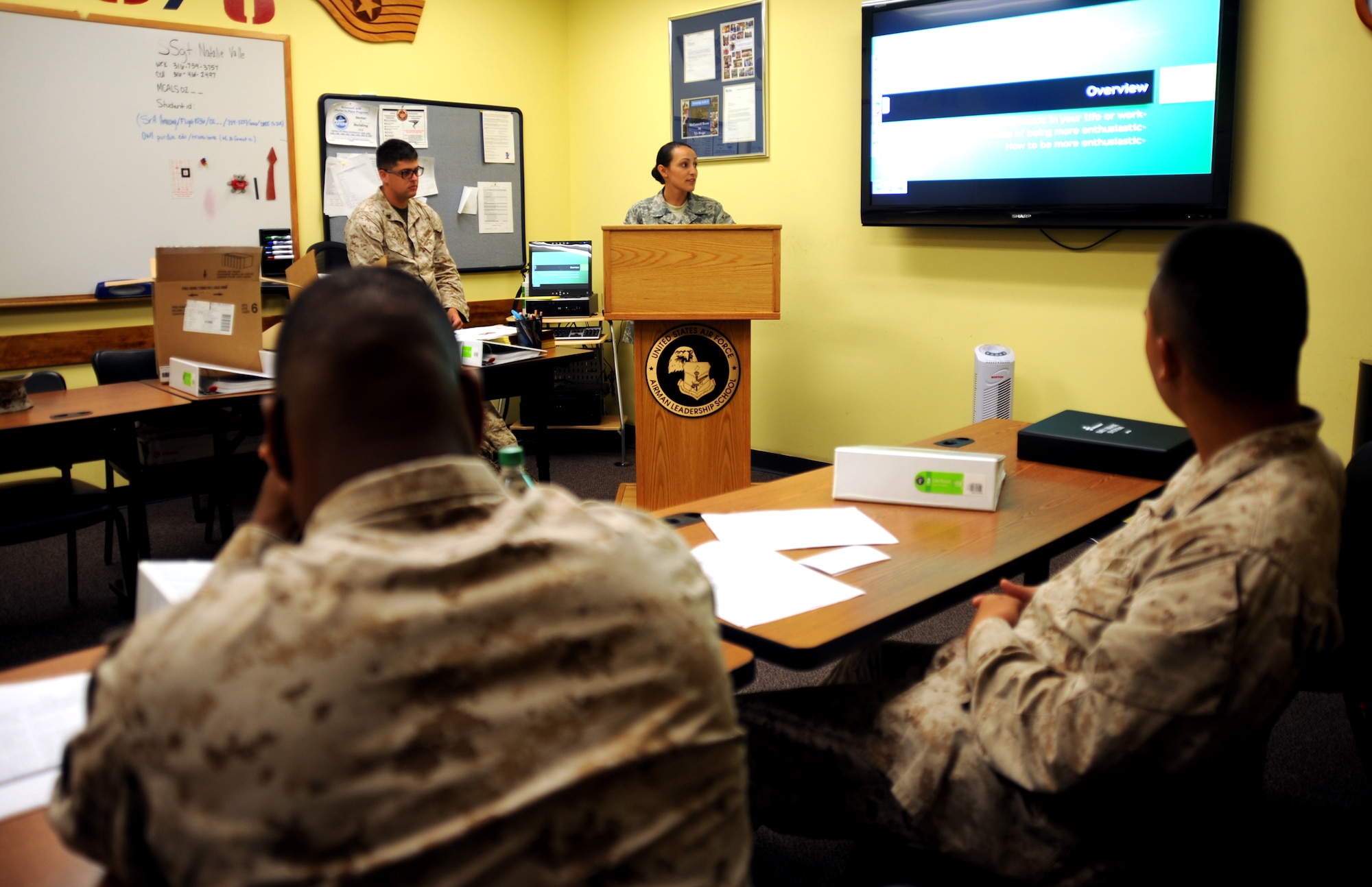 Senior Airman Shalamar Coleman, 22nd Air Refueling Wing knowledge operations manager, speaks to her classmates in the U.S. Marine Corps Corporals Course July 25, 2013, at McConnell Air Force Base, Kan. Coleman spent two weeks working in tandem with Marine corporals from units across the nation, learning about Marine traditions, land navigation, guidon etiquette and the Marine Corps Martial Arts Program. (U.S. Air Force photo/Airman 1st Class Jose L. Leon)