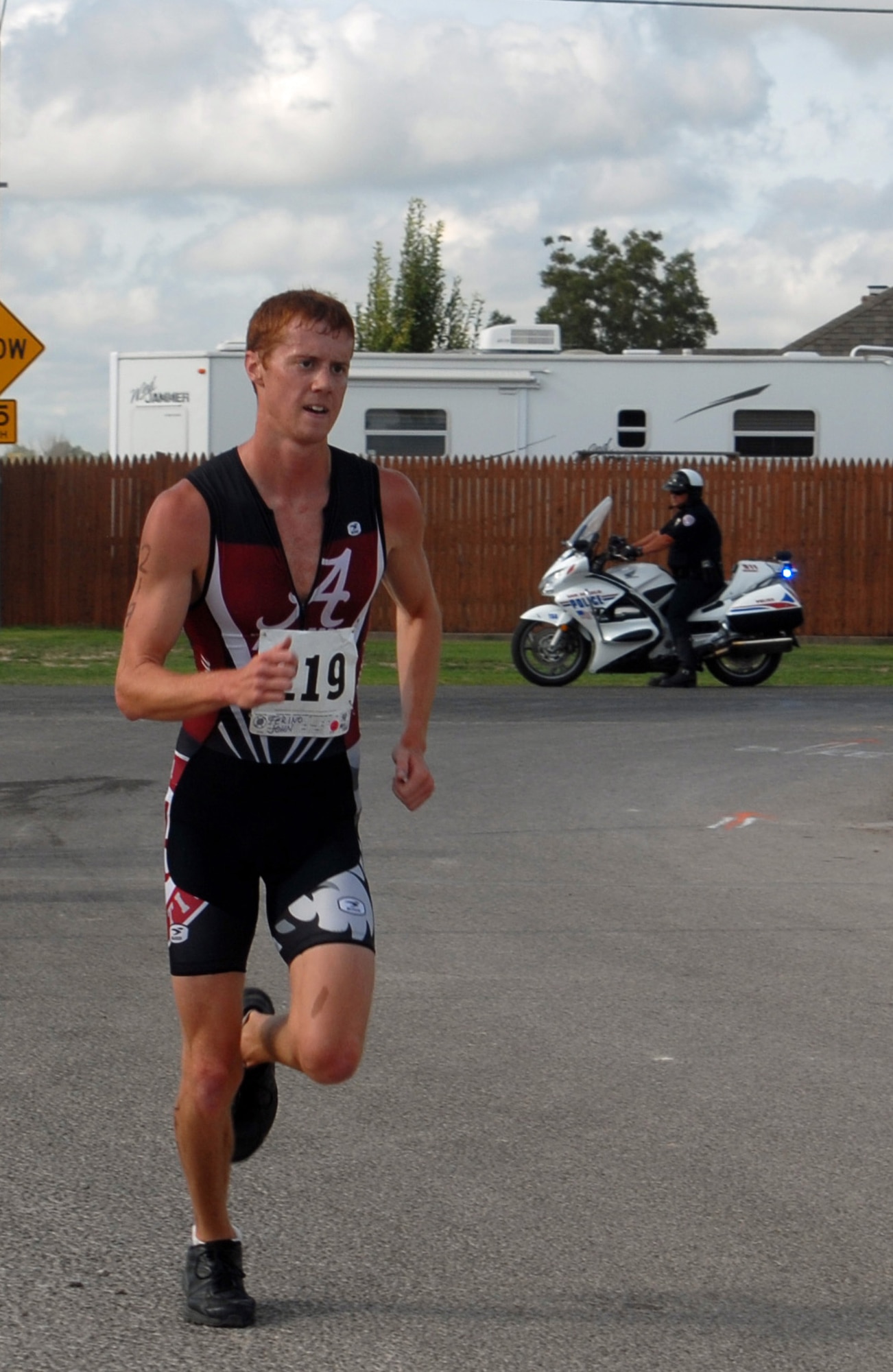 SAN ANGELO, Texas – John Ferino, 2013 Annual Triathlon participant, continues on the last leg of the triathlon at Goodfellow Recreation Camp July 27. Runners started at the Rec Camp and proceeded down South Concho Drive for 2.5-kilometers until they reach the turnaround point then proceeded 2.5-kilometers back to the finish line at the Rec Camp. (U.S. Air Force photo/ Airman 1st Class Breonna Veal)