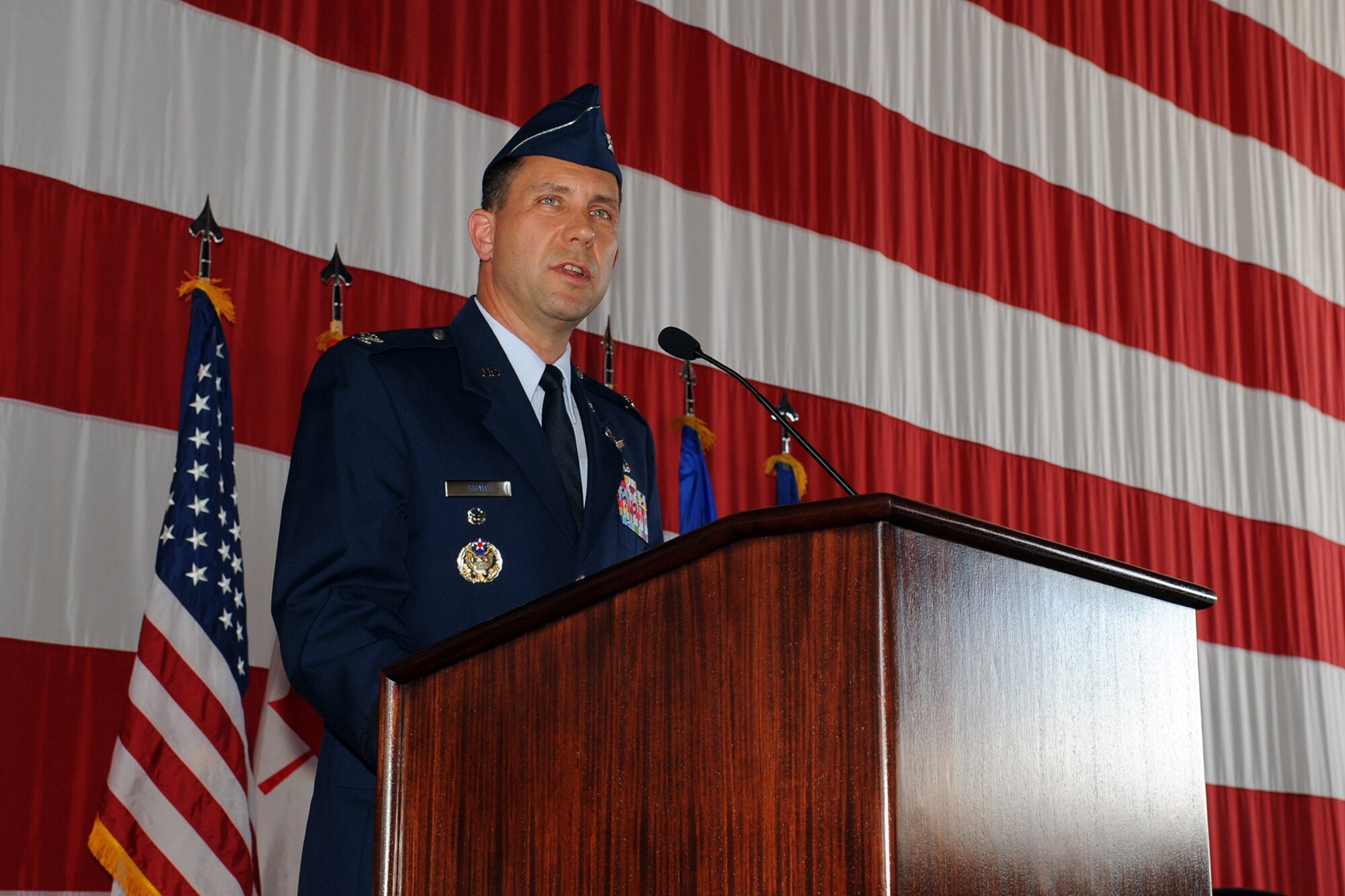 PETERSON AIR FORCE BASE, Colo. – Col. John Shaw, the new 21st Space Wing commander, speaks with the audience during the wing’s change of command ceremony July 26. Shaw replaced outgoing commander Col. Chris Crawford. (U.S. Air Force photo/Rob Bussard)