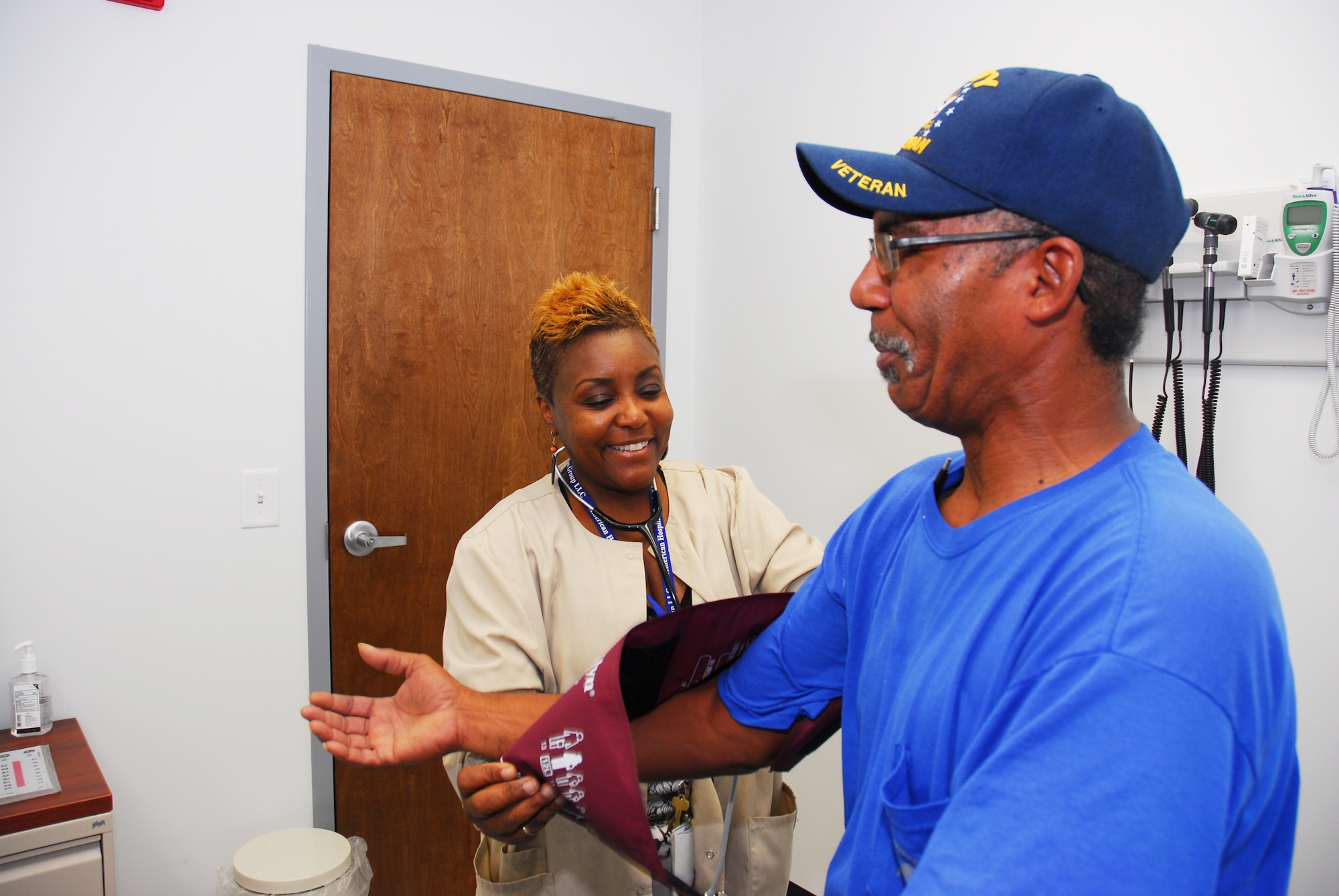 Cheunita Cruz, Fast Forward Clinic nurse practitioner, prepares to get a blood pressure reading from Kenneth Brown, C-17 mechanic, July 18 during the clinic’s walk in hours. The new 2,000-square-foot clinic allows those who work in industrial areas of the Warner Robins Air Logistics Complex access to health professionals, notably within a few minutes’ walk from most work sites. (U.S. Air Force photo by Ed Aspera)