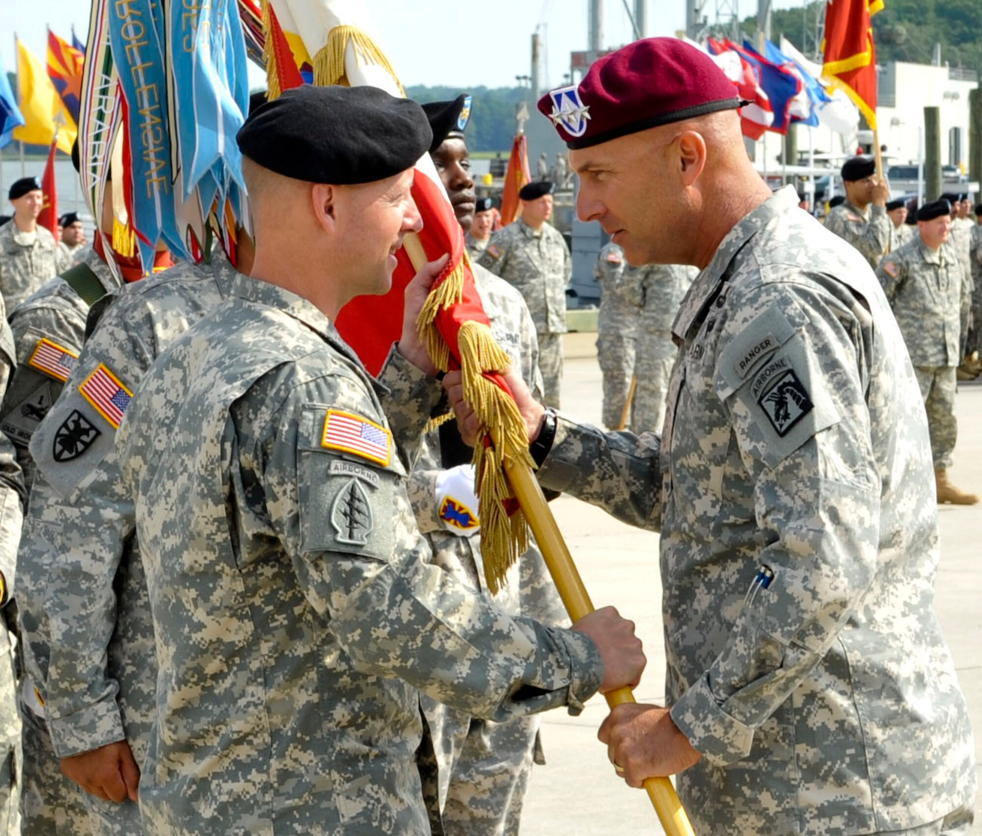 From left, U.S. Army Col. Randal Nelson, incoming 7th Sustainment Brigade commander, accepts the unit’s guidon from U.S. Army Lt. Gen. Joseph Anderson, XVIII Airborne Corps commanding general, during the assumption of command ceremony at Fort Eustis, Va., July 29, 2013. Prior to this assignment, Nelson completed his Senior Service College study at the National Defense University, in Washington, D.C. (U.S. Air Force photo by Staff Sgt. Wesley Farnsworth/Released)